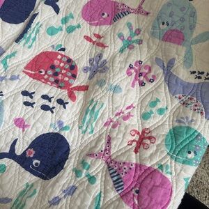 Adorable whale quilt with vibrant colors